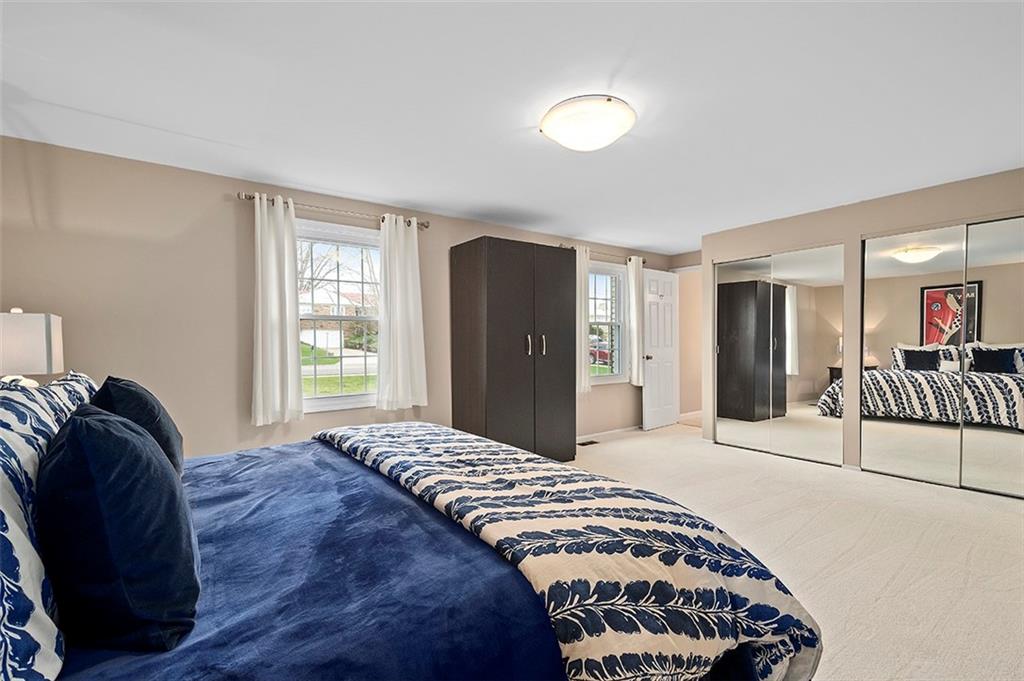 1550 Hastings Mill Road Pittsburgh, PA 15241 - Photo 16 of 25 a bedroom with a bed and a large mirror