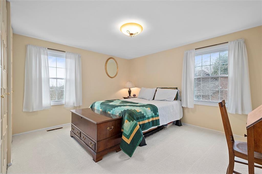 1550 Hastings Mill Road Pittsburgh, PA 15241 - Photo 18 of 25 a spacious bedroom with a bed and a window