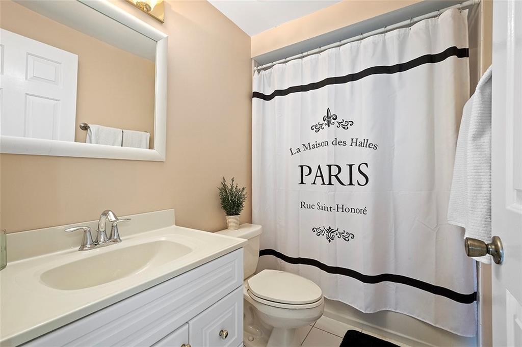 1550 Hastings Mill Road Pittsburgh, PA 15241 - Photo 21 of 25 a bathroom with a granite countertop sink toilet and a mirror