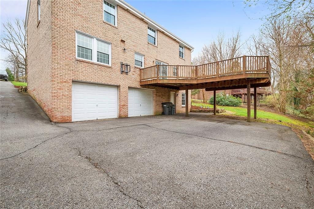 1550 Hastings Mill Road Pittsburgh, PA 15241 - Photo 23 of 25 a front view of a house with a yard and garage