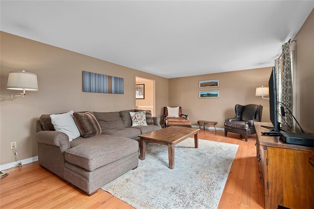 1550 Hastings Mill Road Pittsburgh, PA 15241 - Photo 4 of 25 a living room with furniture and a flat screen tv