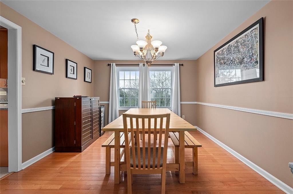 1550 Hastings Mill Road Pittsburgh, PA 15241 - Photo 6 of 25 a view of a dining room with furniture window and wooden floor