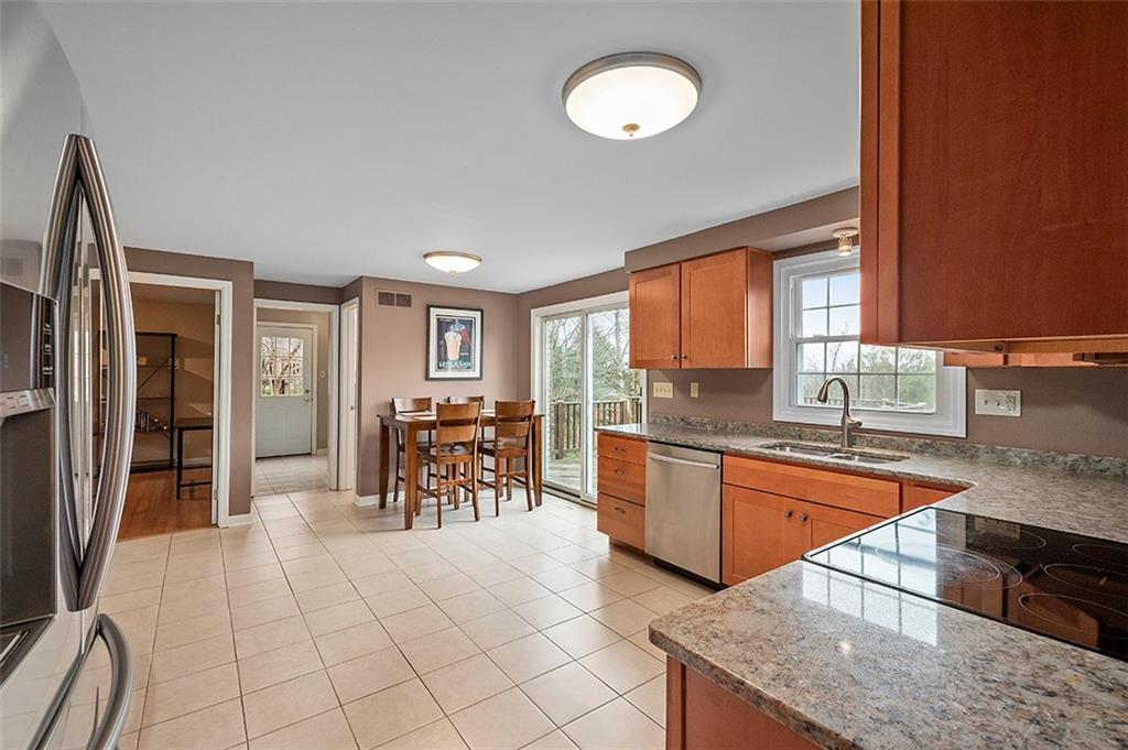 1550 Hastings Mill Road Pittsburgh, PA 15241 - Photo 8 of 25 a kitchen with granite countertop a sink cabinets and stainless steel appliances