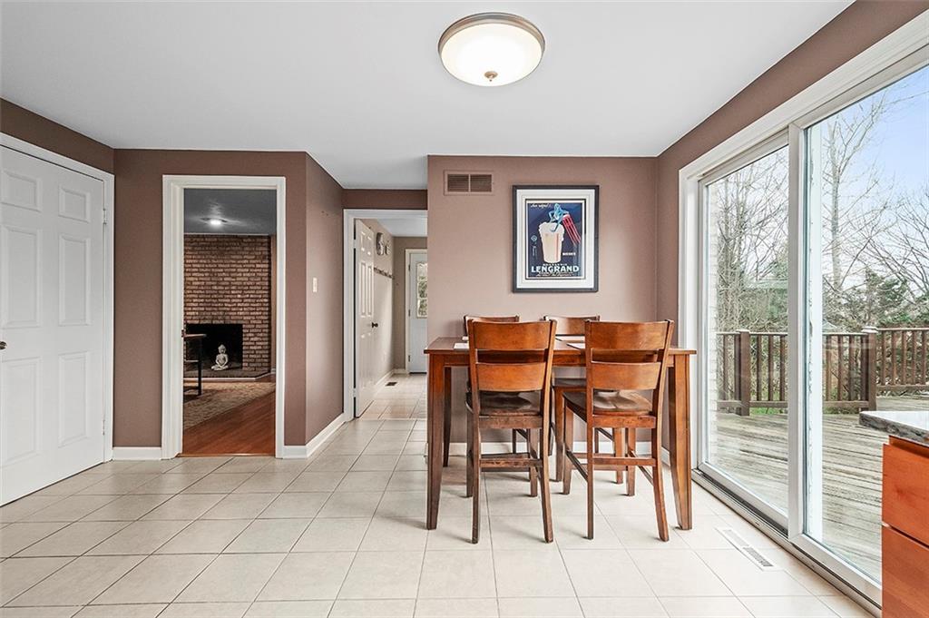 1550 Hastings Mill Road Pittsburgh, PA 15241 - Photo 10 of 25 a dining room with furniture and a floor to ceiling window