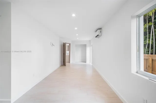 a view of a hallway with a white walls