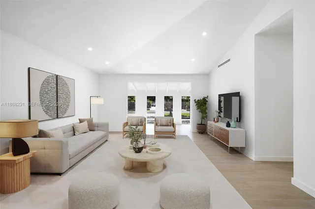 a living room with furniture and a large window