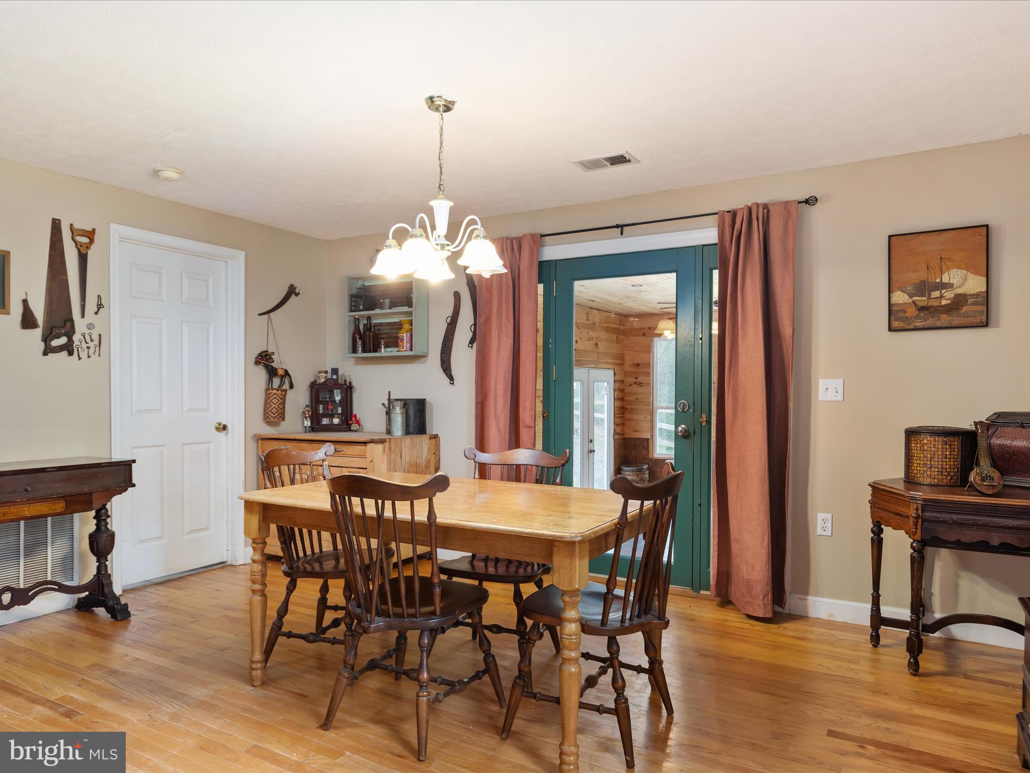 838 Dollar Lane Bunker Hill, WV 25413 - Photo 12 of 68 a view of a dining room with furniture and wooden floor