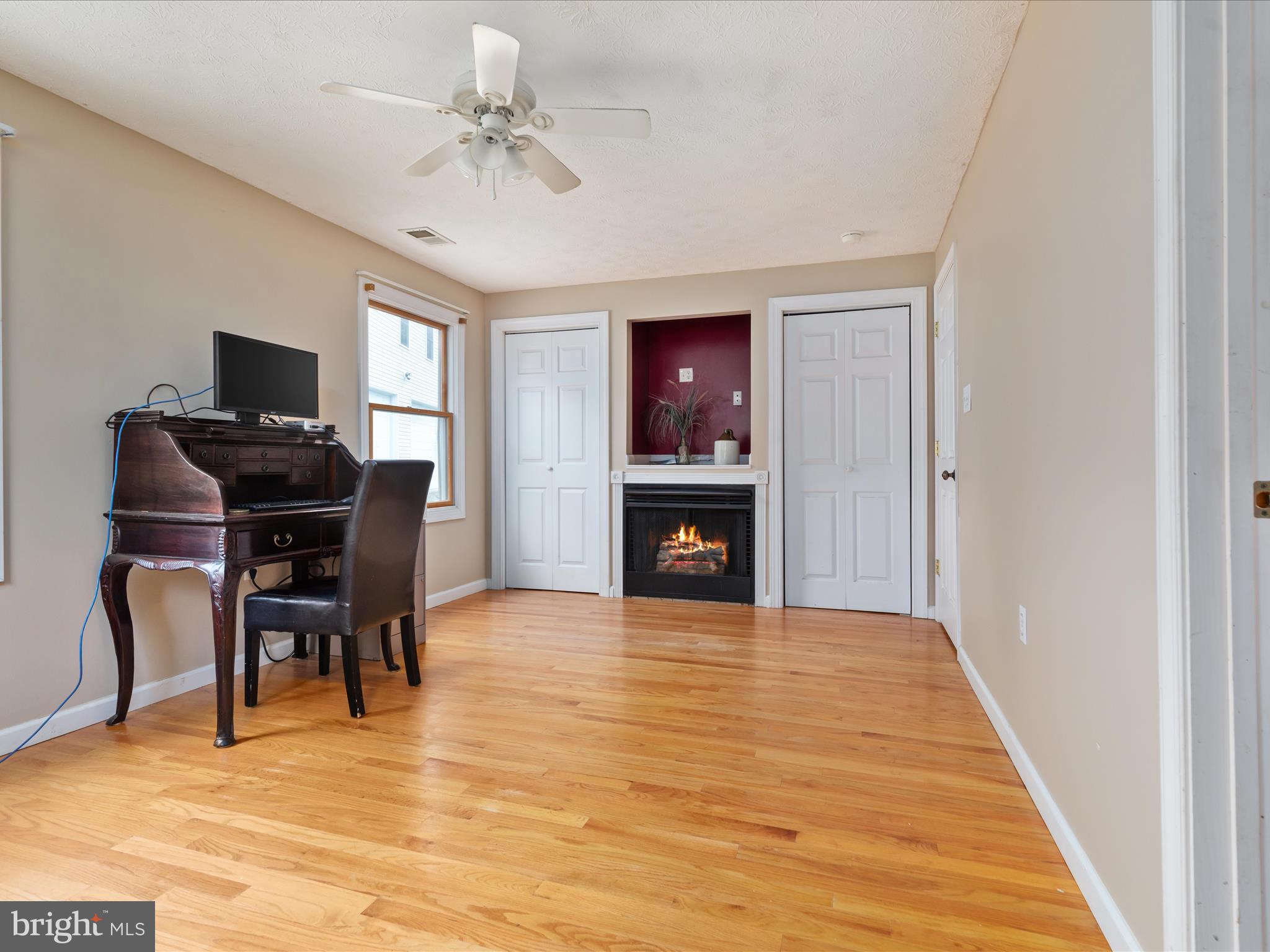 838 Dollar Lane Bunker Hill, WV 25413 - Photo 16 of 68 a view of a livingroom with a fireplace and workspace