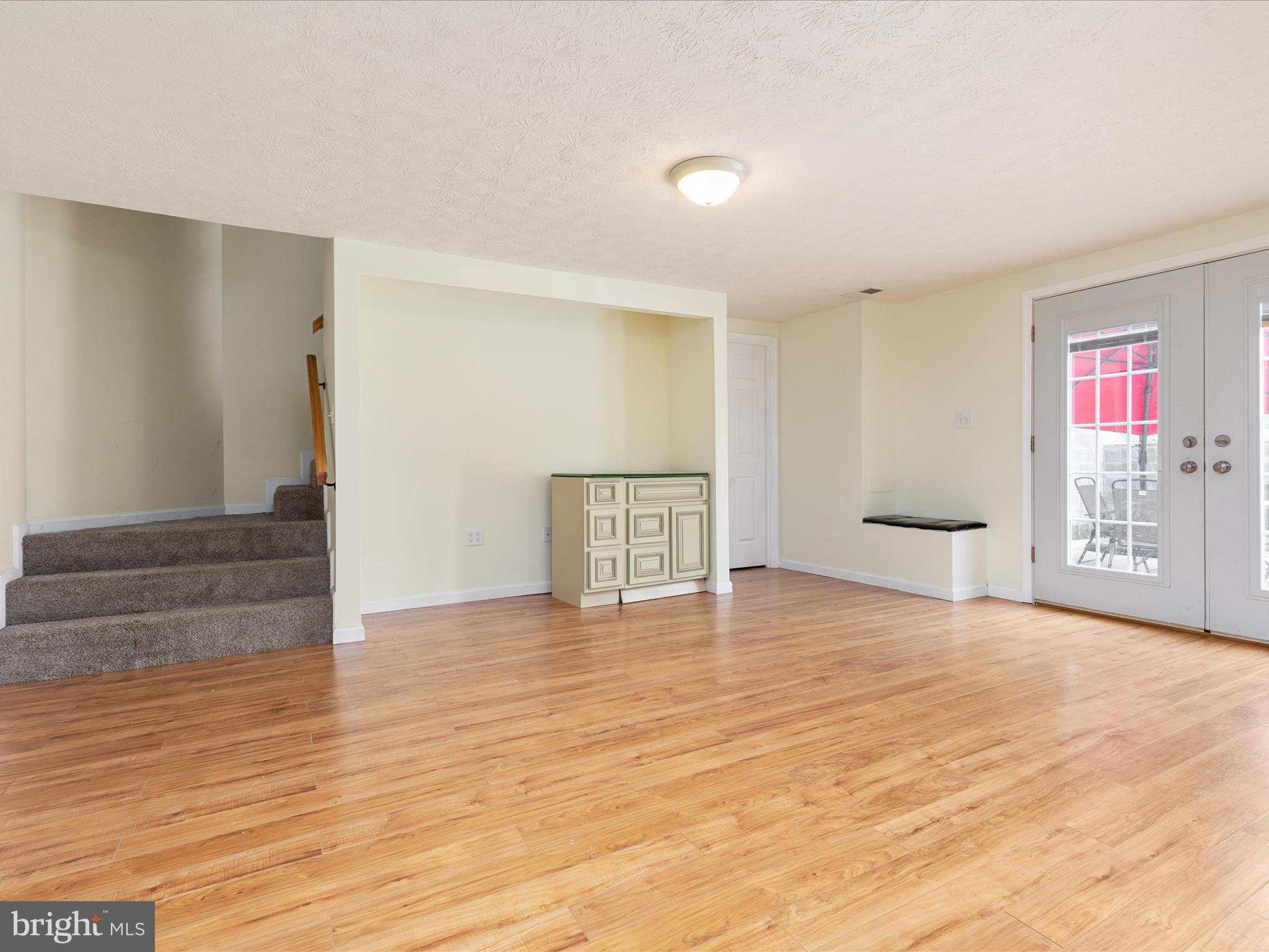 838 Dollar Lane Bunker Hill, WV 25413 - Photo 20 of 68 a view of an empty room with window and wooden floor