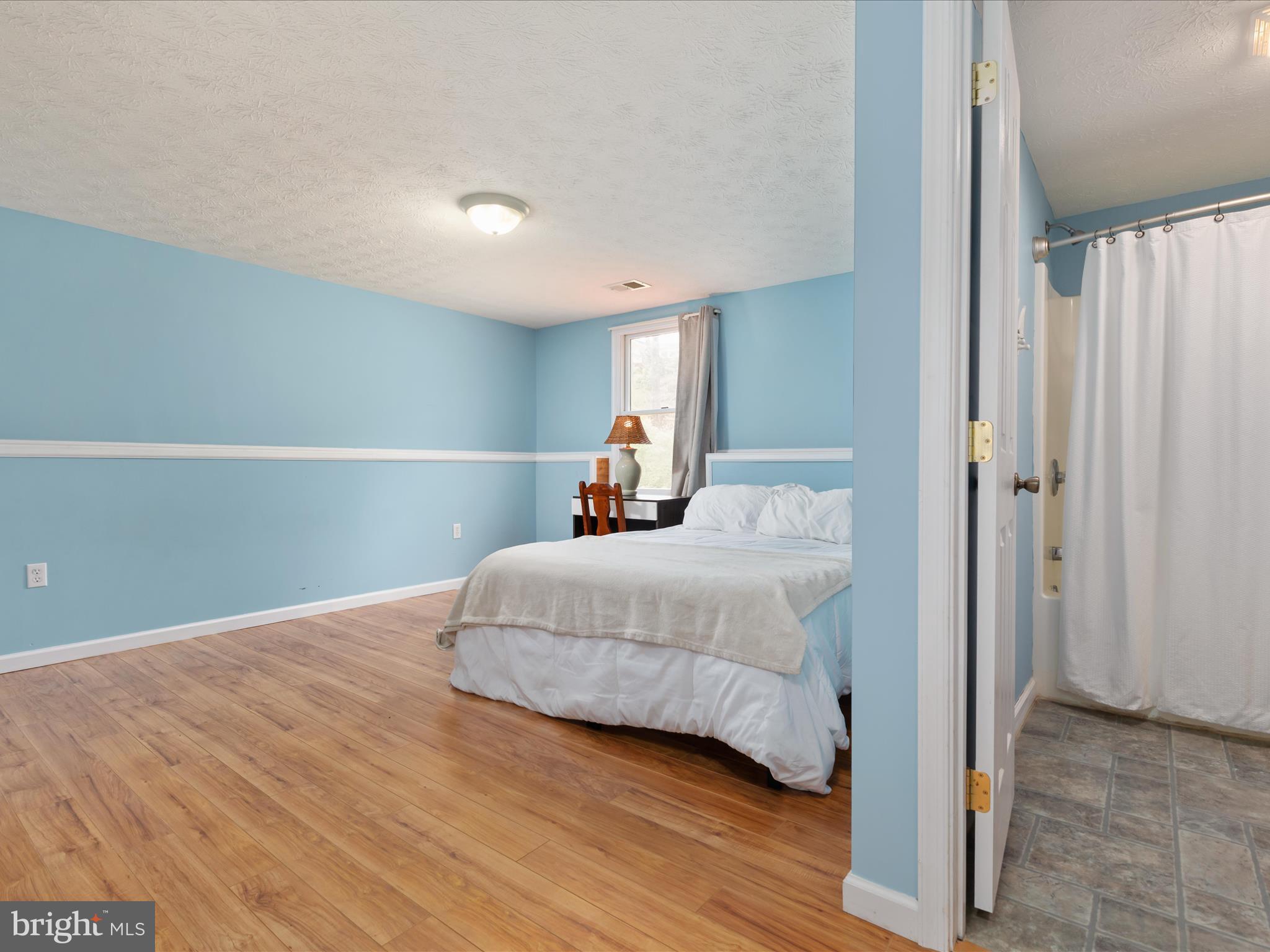 838 Dollar Lane Bunker Hill, WV 25413 - Photo 21 of 68 a bedroom with a bed and a window