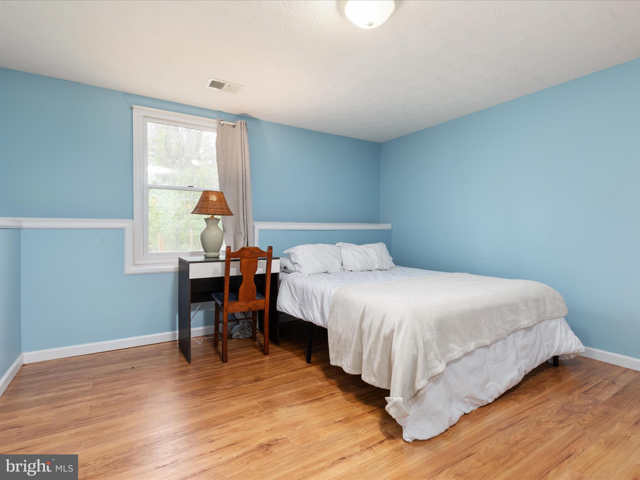 838 Dollar Lane Bunker Hill, WV 25413 - Photo 22 of 68 a bed room with a bed and a table