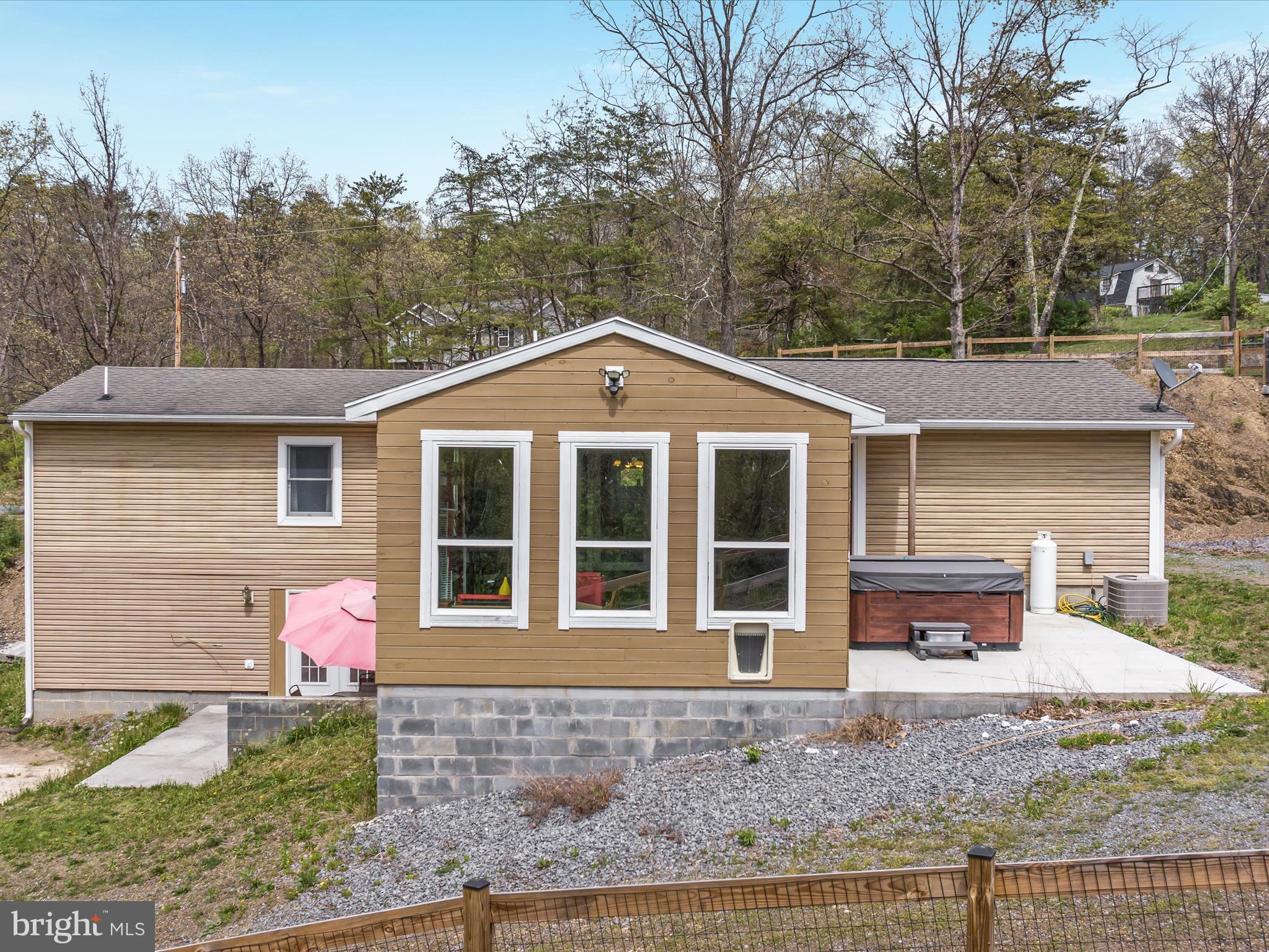 838 Dollar Lane Bunker Hill, WV 25413 - Photo 26 of 68 a front view of a house with garden