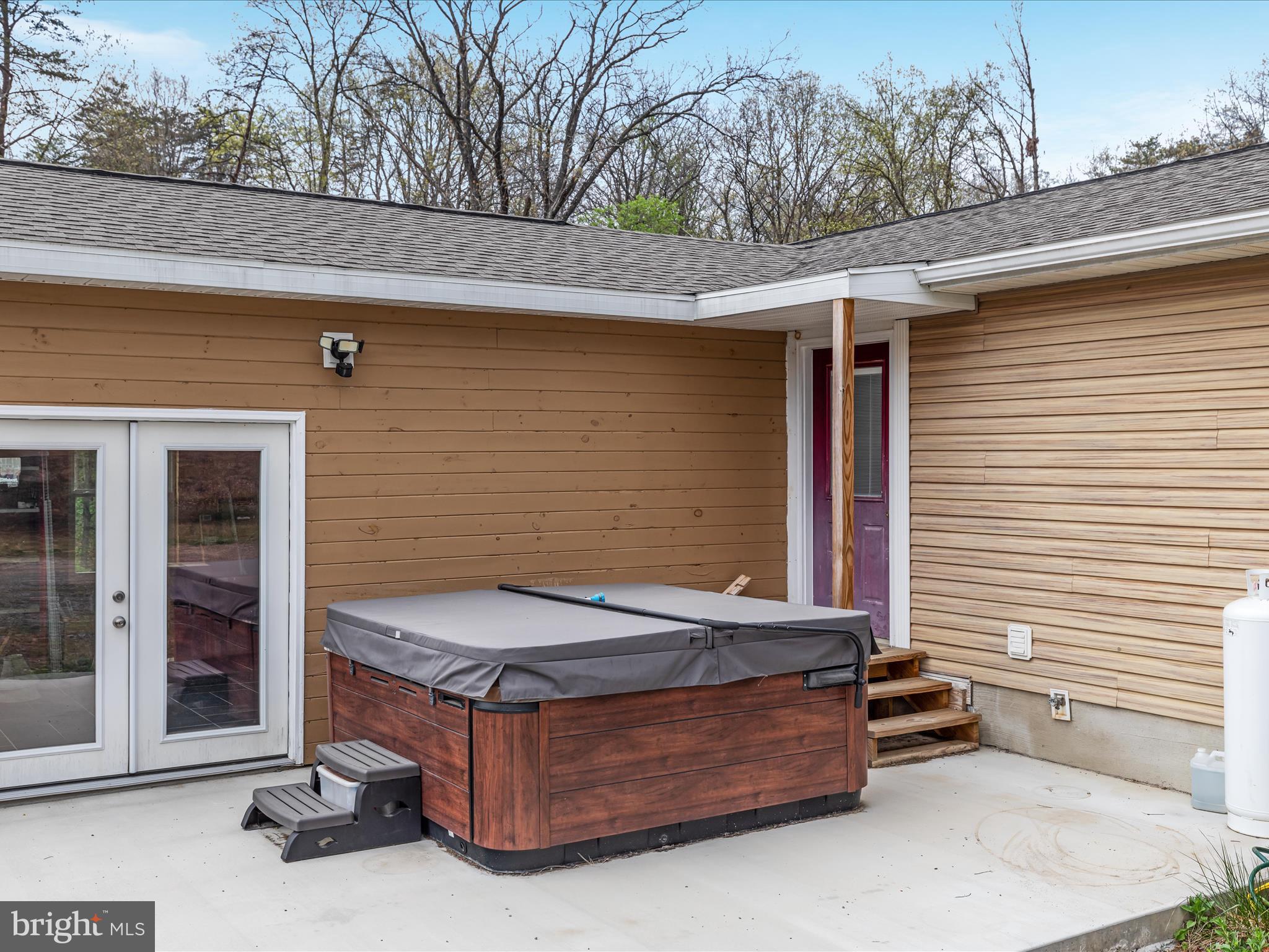 838 Dollar Lane Bunker Hill, WV 25413 - Photo 27 of 68 a view of backyard with a chair and iron fence