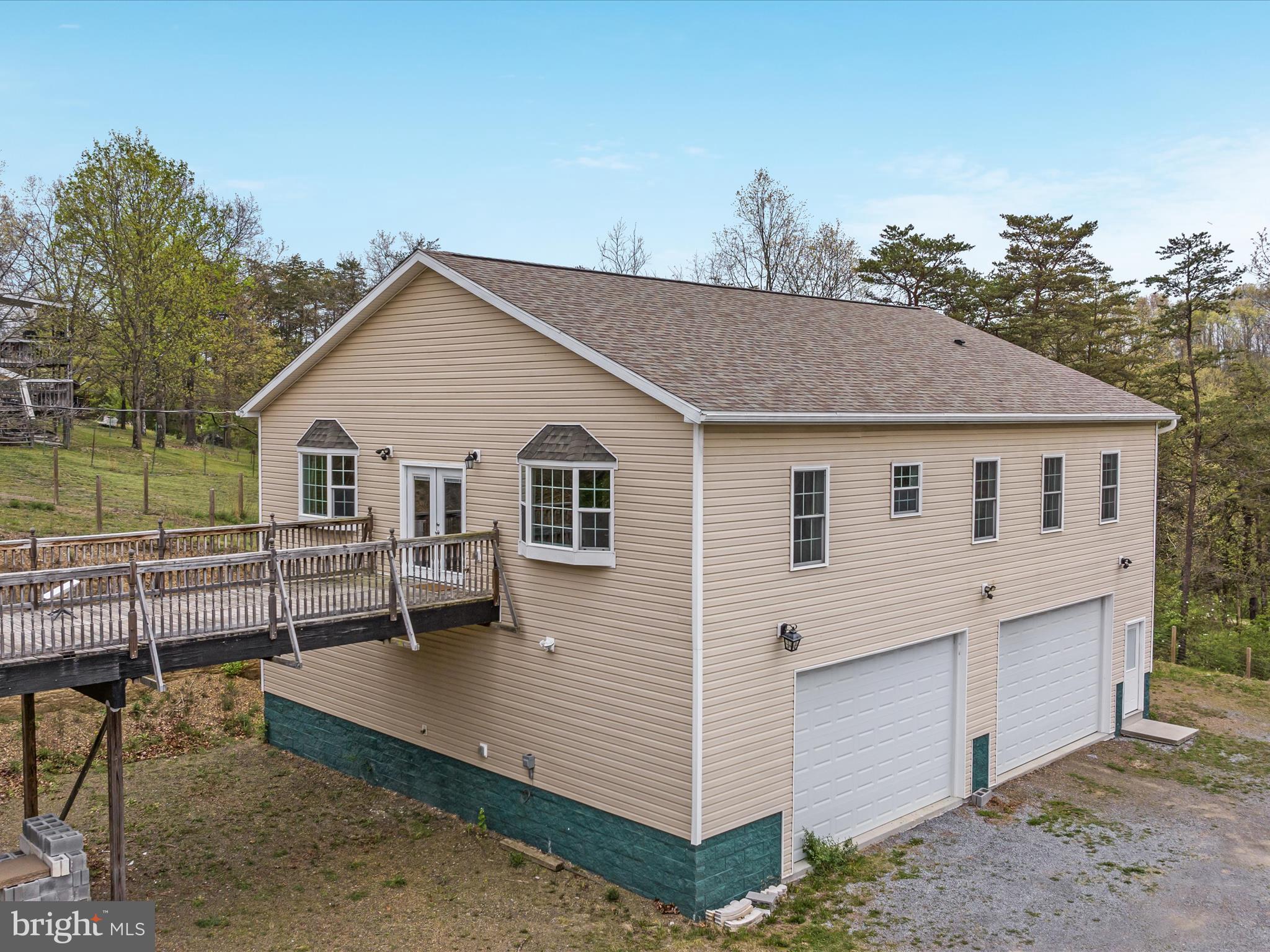 838 Dollar Lane Bunker Hill, WV 25413 - Photo 29 of 68 a view of a white house with a yard