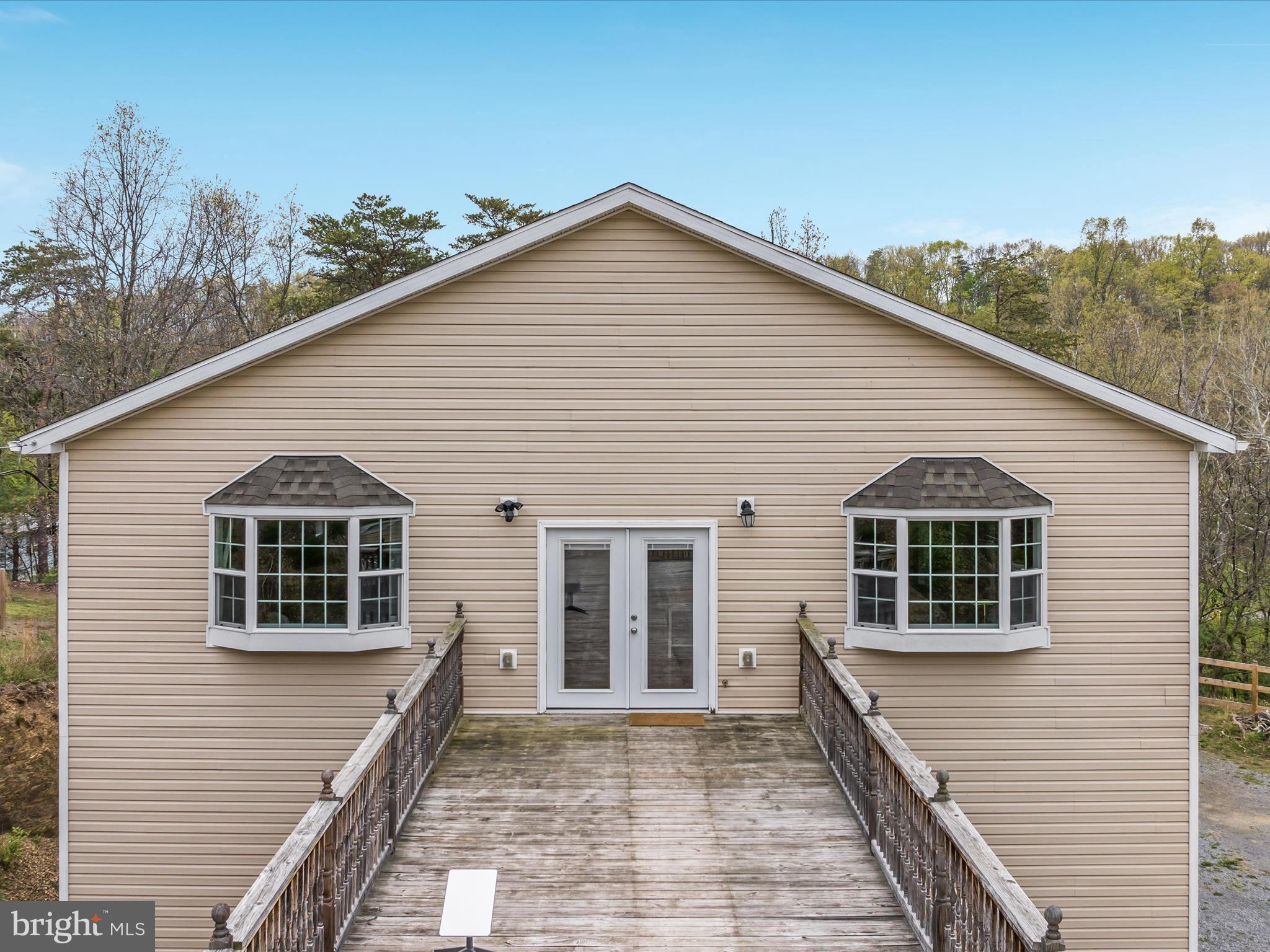838 Dollar Lane Bunker Hill, WV 25413 - Photo 30 of 68 a front view of a house with a balcony