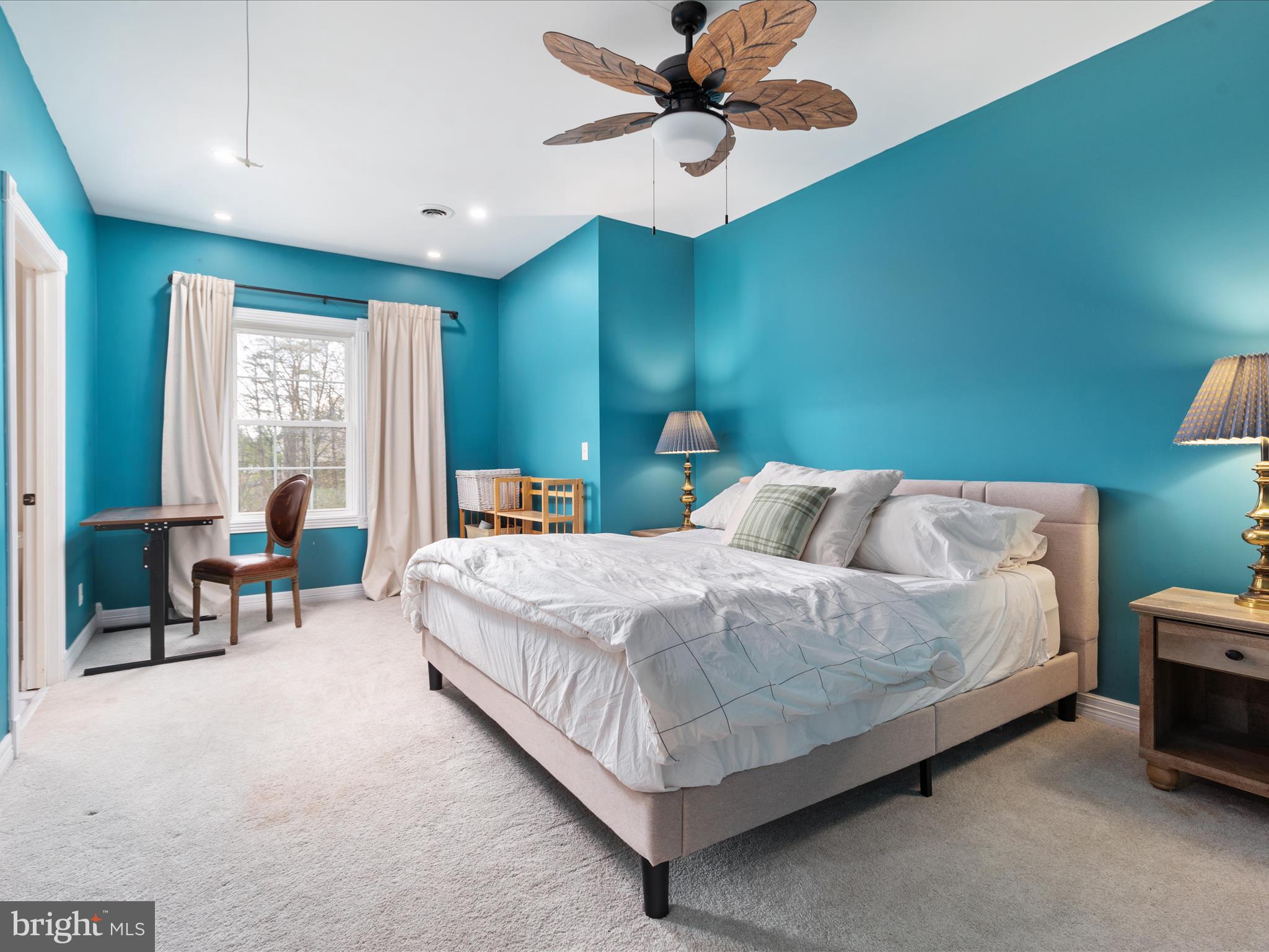 838 Dollar Lane Bunker Hill, WV 25413 - Photo 31 of 68 a bedroom with a bed chandelier and a window