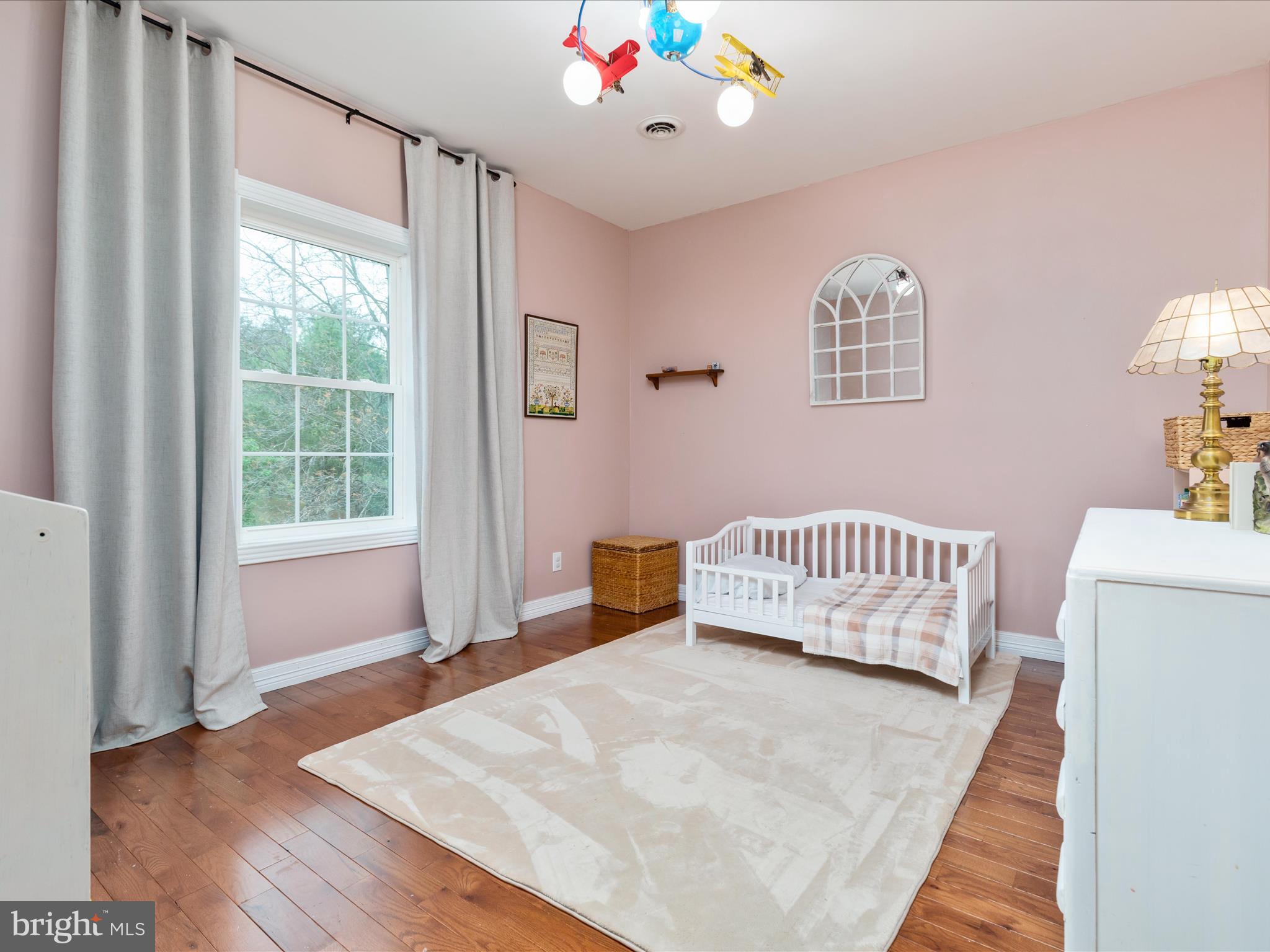 838 Dollar Lane Bunker Hill, WV 25413 - Photo 36 of 68 a bedroom with a bed and a window
