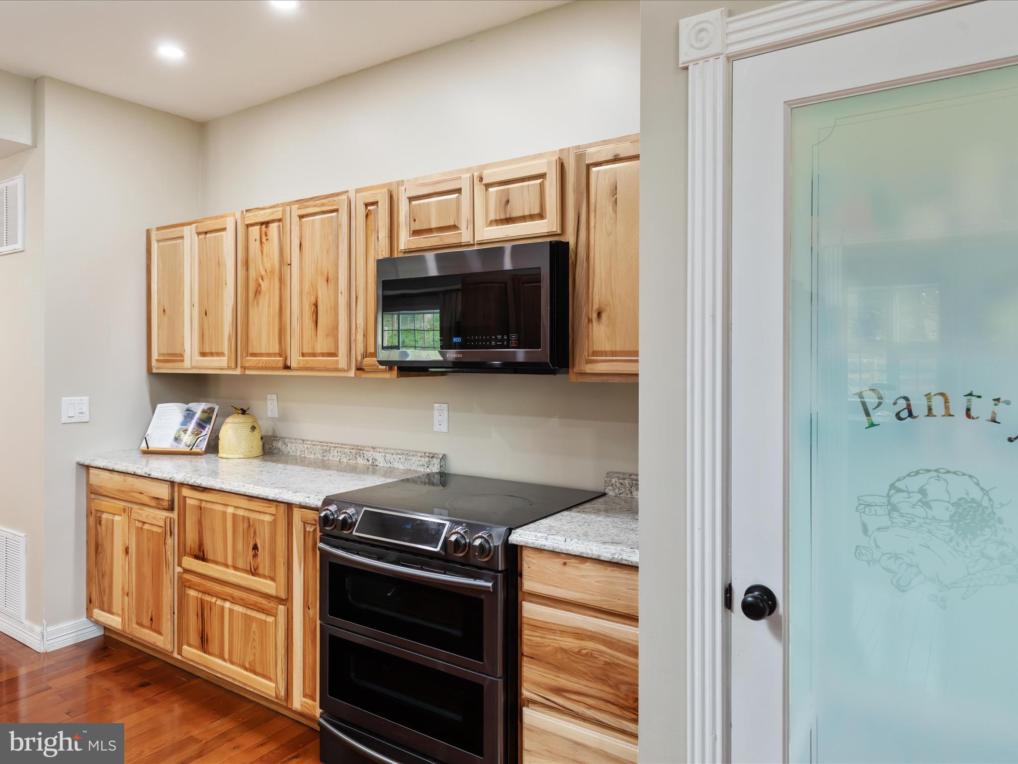 838 Dollar Lane Bunker Hill, WV 25413 - Photo 49 of 68 a kitchen with a stove and a microwave