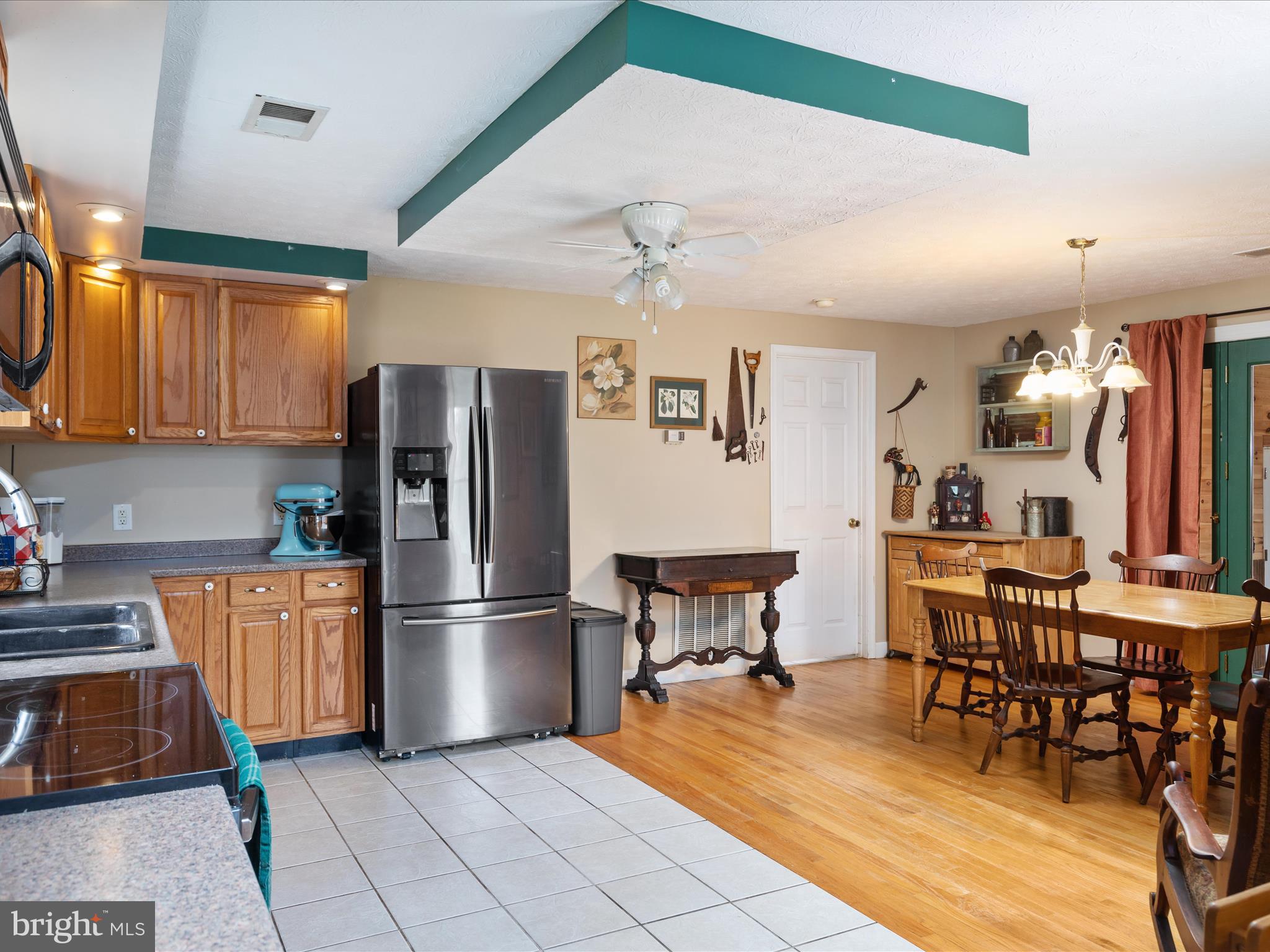 838 Dollar Lane Bunker Hill, WV 25413 - Photo 9 of 68 a kitchen with stainless steel appliances granite countertop a refrigerator and a sink