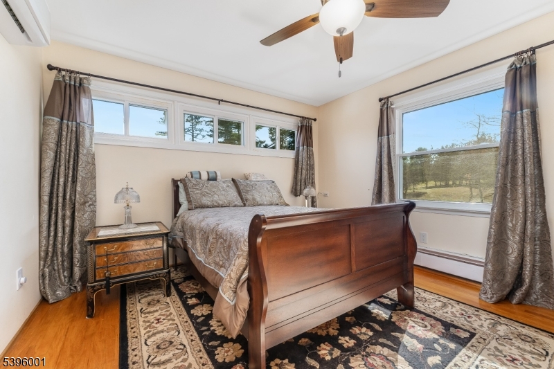 417 Mountain Road Lebanon, NJ 08833 - Photo 20 of 40 a bedroom with a bed and a window