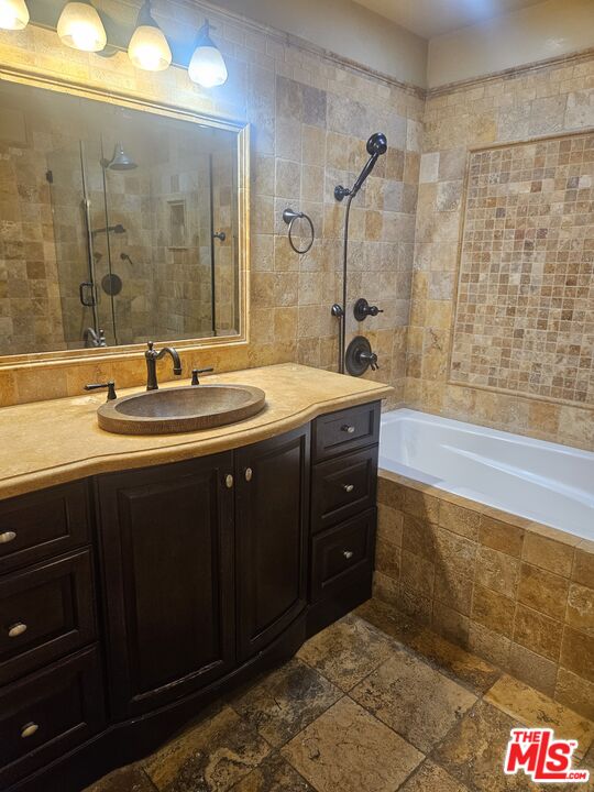 1880 Veteran Avenue, Unit 107 Los Angeles, CA 90025 - Photo 12 of 26 a bathroom with a sink and a mirror