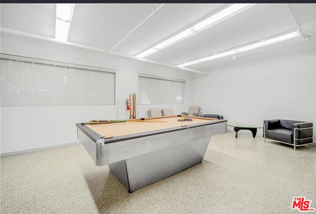 1880 Veteran Avenue, Unit 107 Los Angeles, CA 90025 - Photo 23 of 26 a living room with stainless steel appliances furniture and a kitchen view