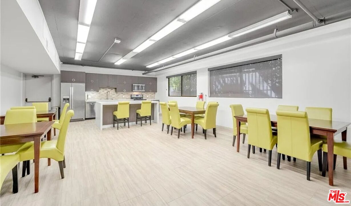 1880 Veteran Avenue, Unit 107 Los Angeles, CA 90025 - Photo 24 of 26 a living room with lots of furniture and wooden floors