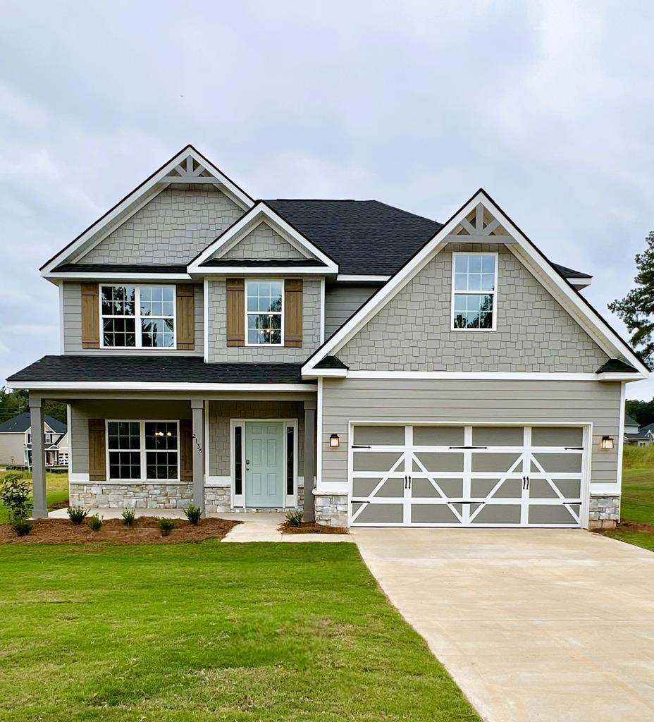 front view of a house with a yard