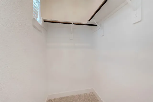 a view of small space with racks on the wall