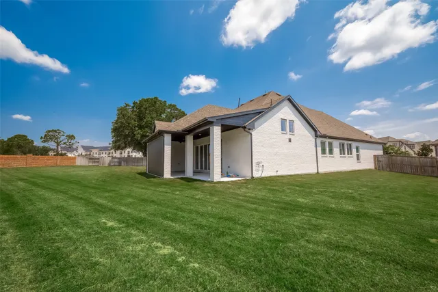 a view of a house with a big yard