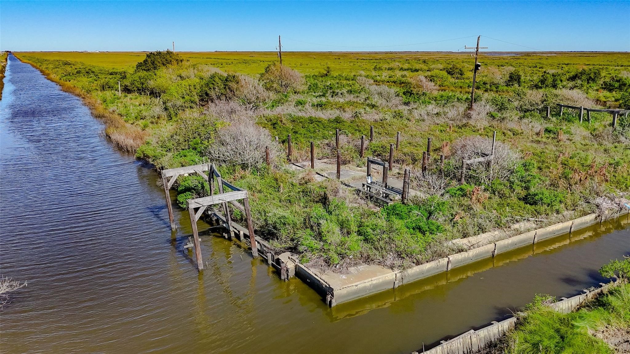 1015 3rd Street Port Bolivar, TX 77650 - Photo 1 of 10 an aerial view of a house with a yard