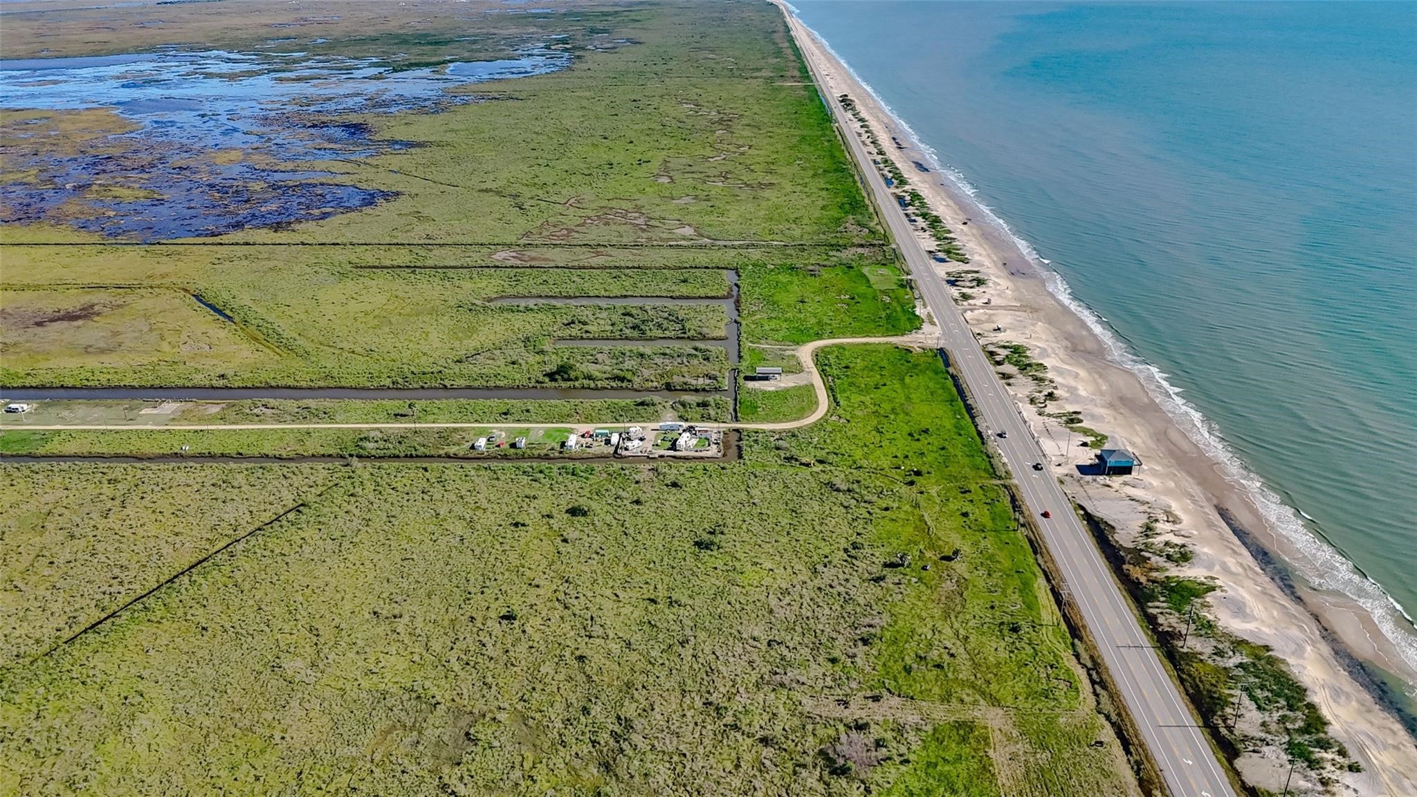 1015 3rd Street Port Bolivar, TX 77650 - Photo 4 of 10 a view of swimming pool with a yard