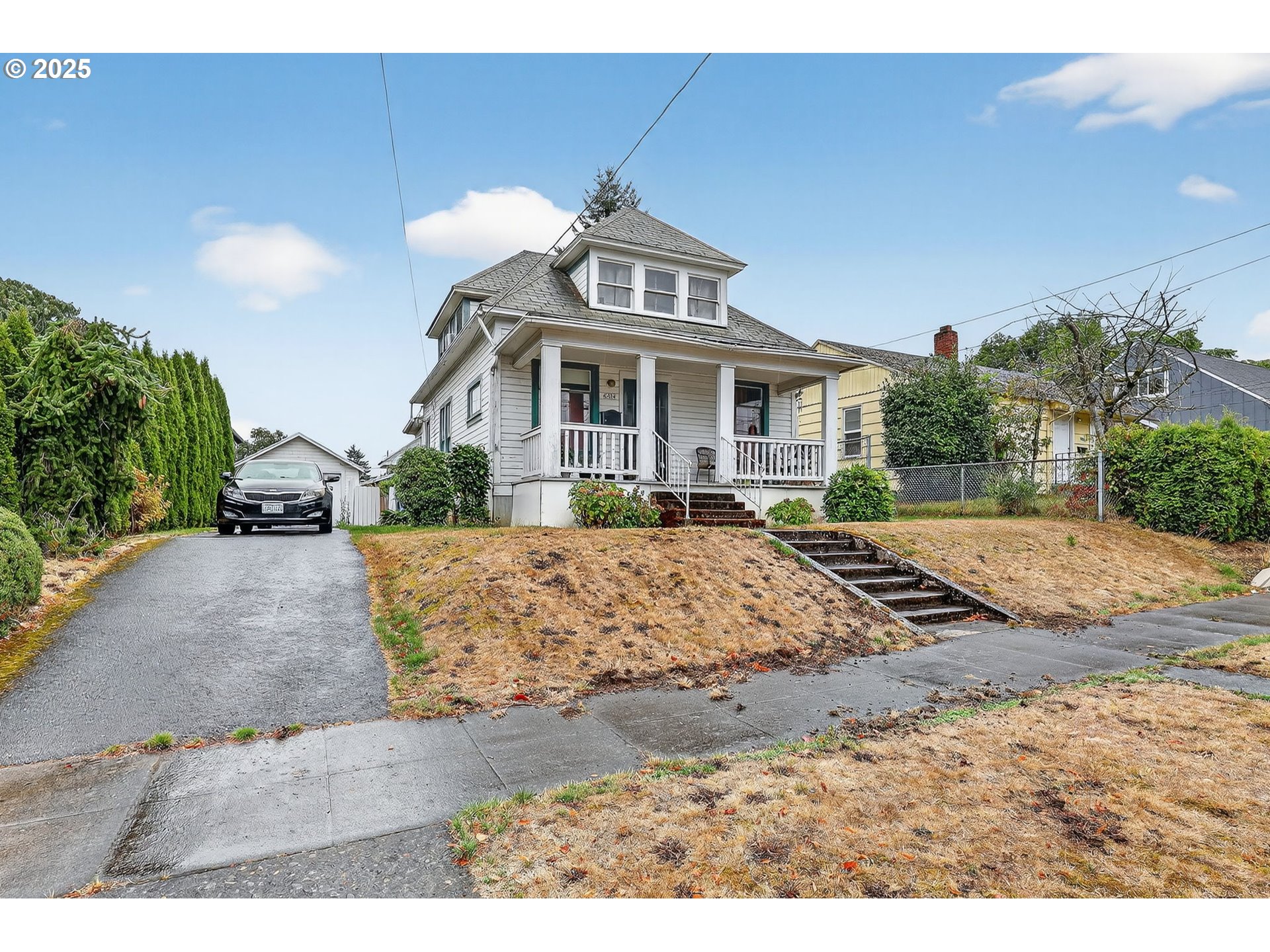 6404 Northeast 10th Avenue Portland, OR 97211 - Photo 28 of 31 a front view of a house with a yard