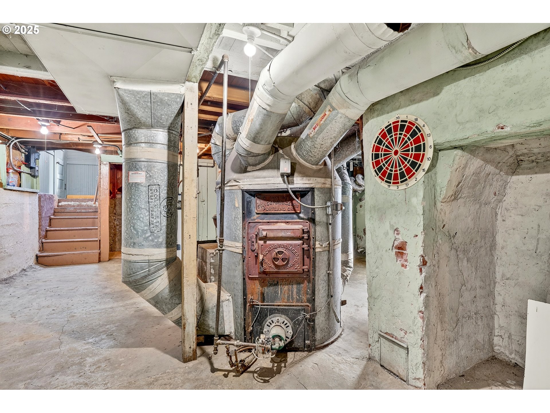 6404 Northeast 10th Avenue Portland, OR 97211 - Photo 29 of 31 a view of a hallway with entryway a house and chandelier