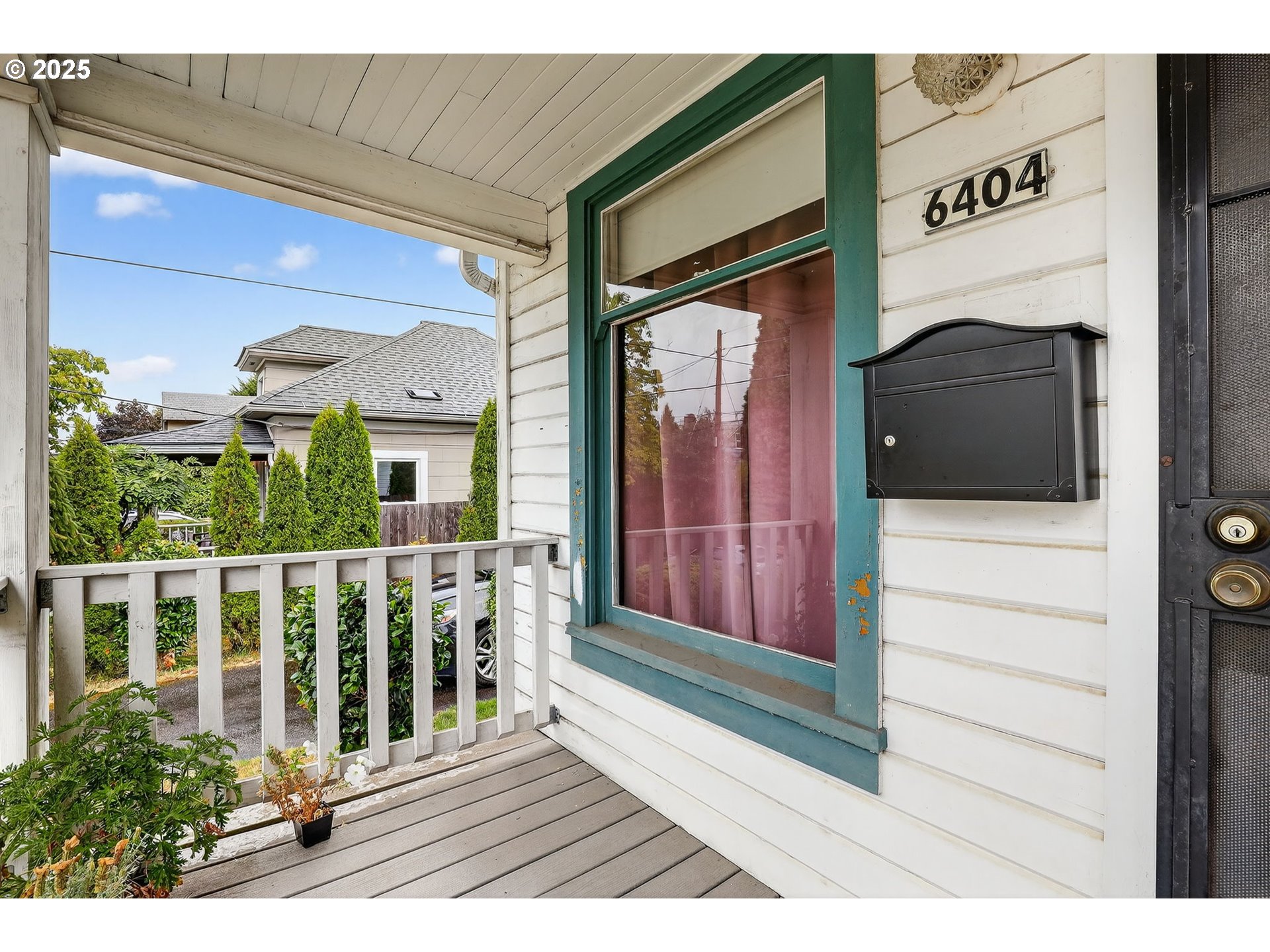 6404 Northeast 10th Avenue Portland, OR 97211 - Photo 3 of 31 a view of a balcony with furniture and wooden floor