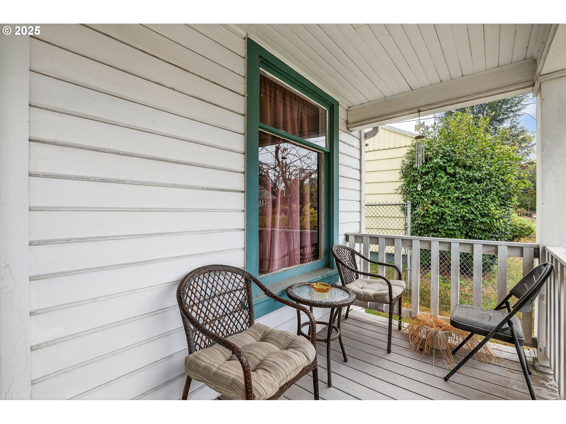6404 Northeast 10th Avenue Portland, OR 97211 - Photo 4 of 31 a balcony view with a couple of chairs and a potted plant