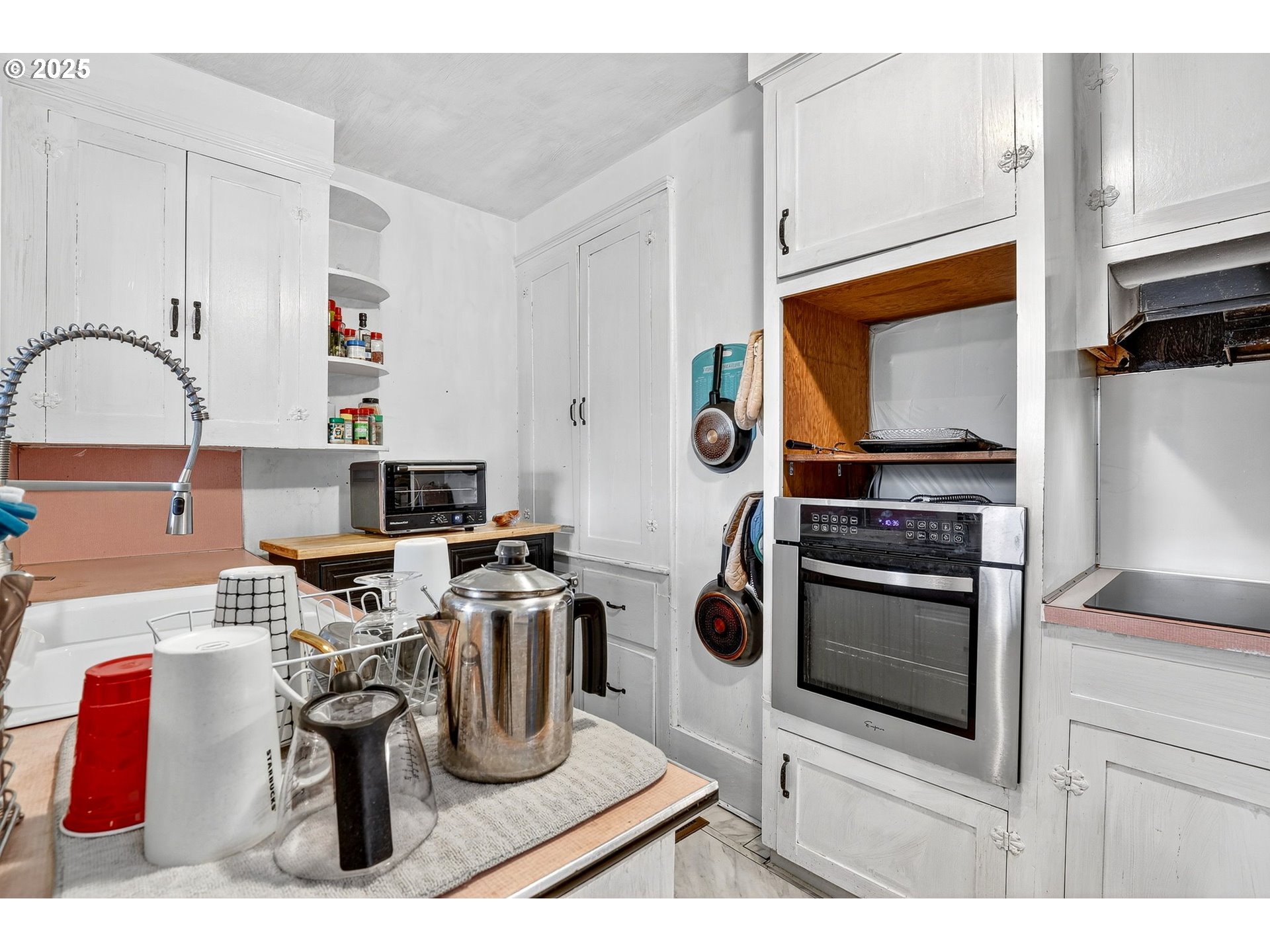 6404 Northeast 10th Avenue Portland, OR 97211 - Photo 9 of 31 a kitchen with a stove and a microwave