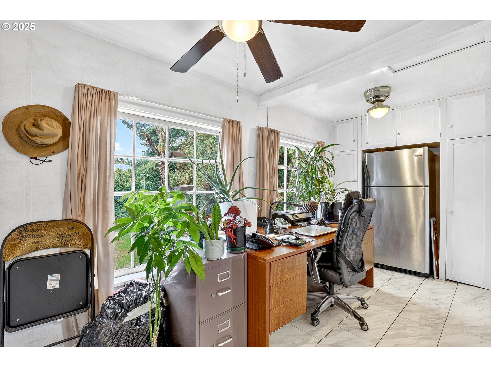 6404 Northeast 10th Avenue Portland, OR 97211 - Photo 10 of 31 a living room with furniture a window and a chandelier