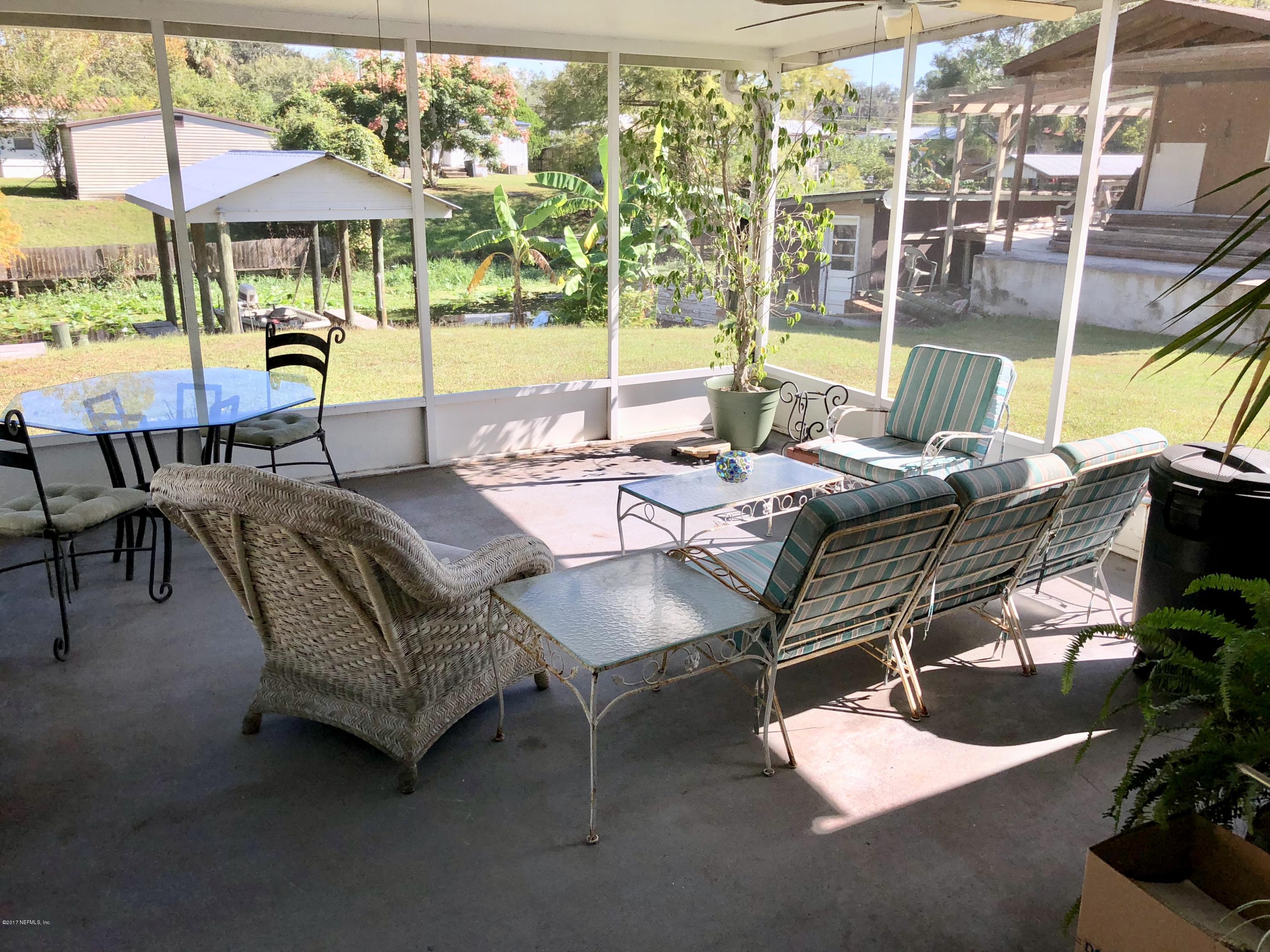 126 Riverside Avenue Satsuma, FL 32189 - Photo 15 of 22 Screened back porch