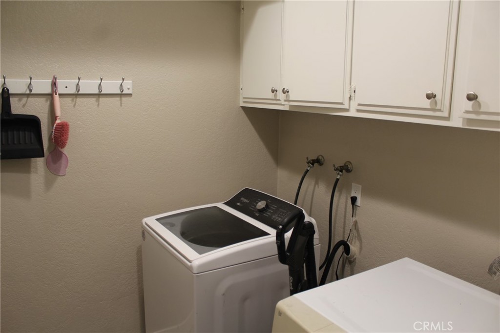 8267 San Bernardino Road Rancho Cucamonga, CA 91730 - Photo 12 of 32 a utility room with dryer and washer