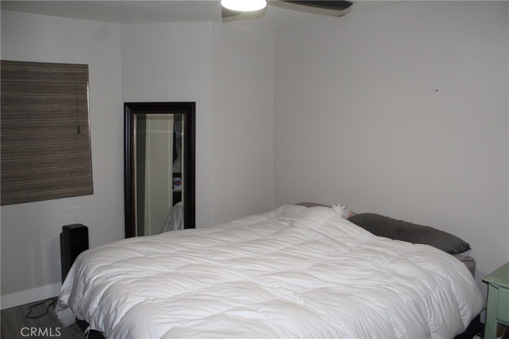 8267 San Bernardino Road Rancho Cucamonga, CA 91730 - Photo 16 of 32 a large bed in a bedroom next to a window