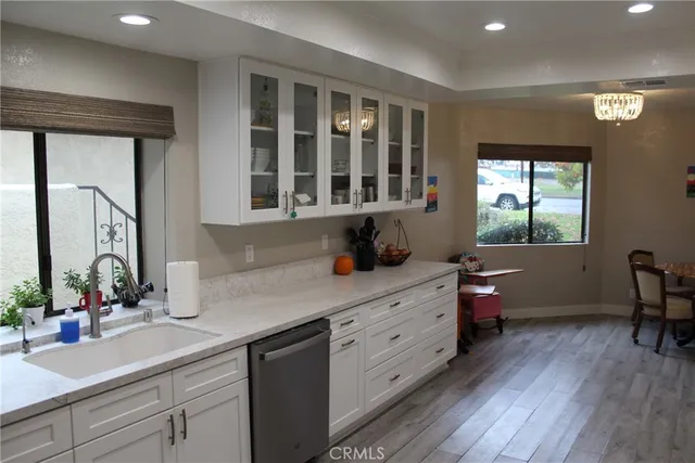a kitchen with a wooden cabinets and sink