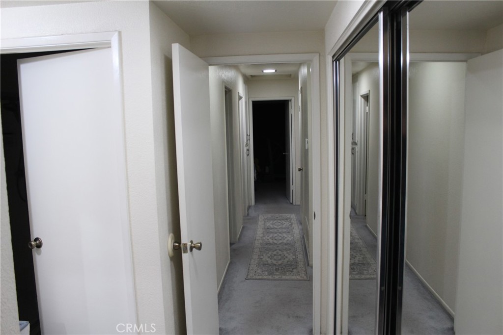 8267 San Bernardino Road Rancho Cucamonga, CA 91730 - Photo 22 of 32 a view of a hallway with closet and a door