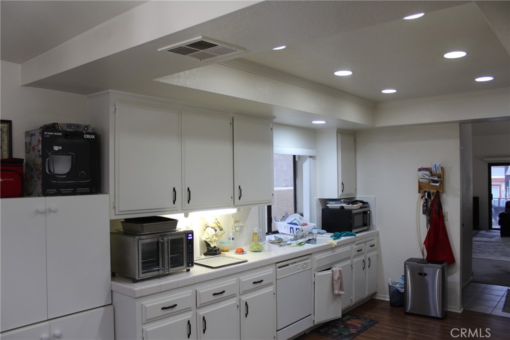 8267 San Bernardino Road Rancho Cucamonga, CA 91730 - Photo 30 of 32 a kitchen with stainless steel appliances granite countertop a sink and cabinets