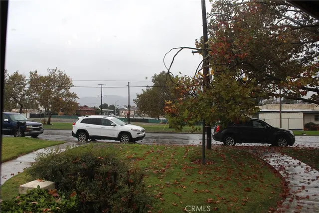 a view of street with parked cars