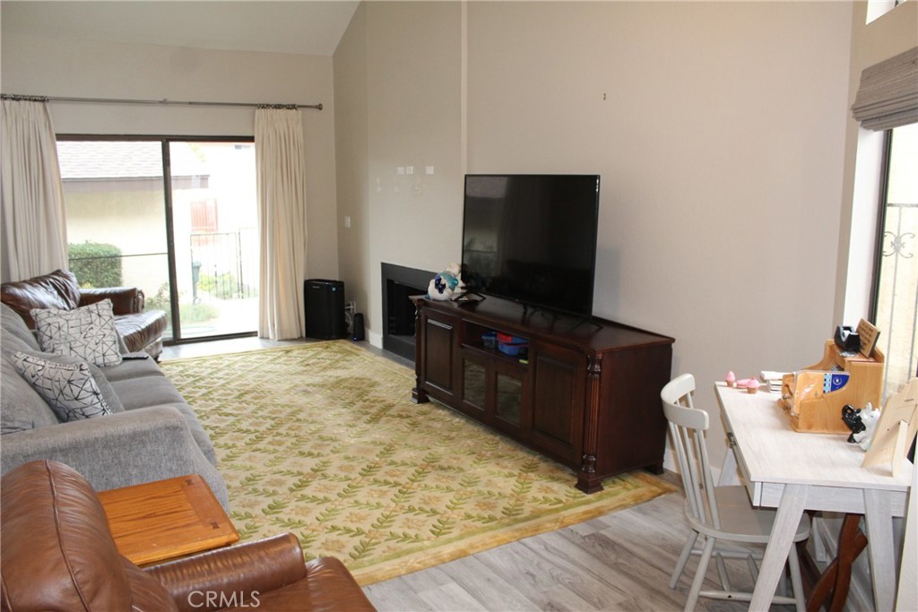 8267 San Bernardino Road Rancho Cucamonga, CA 91730 - Photo 8 of 32 a living room with furniture and a flat screen tv