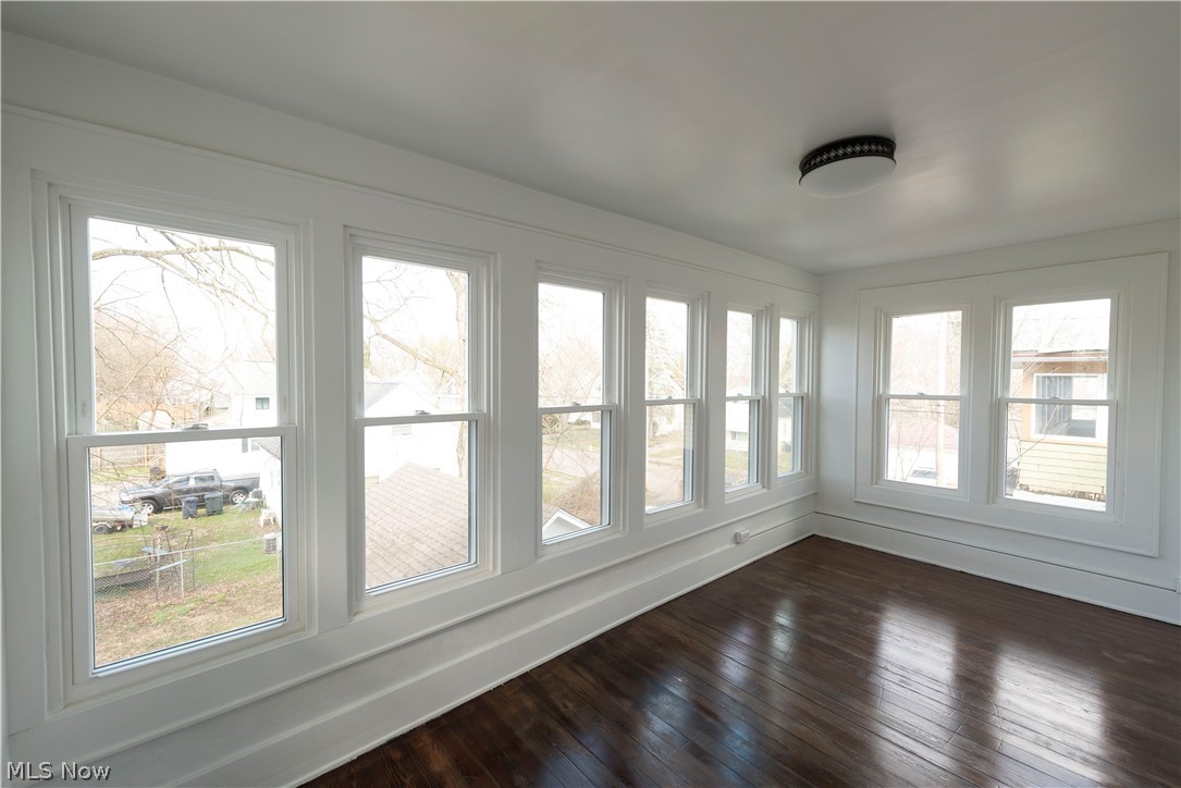 1022 North Howard Street Akron, OH 44310 - Photo 22 of 38 Bedroom 4 / sunroom with a total of 10 brand new, double pane vinyl windows