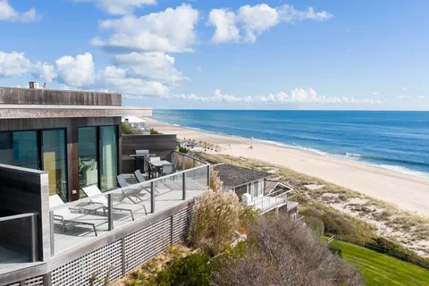 a view of balcony with furniture