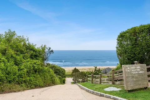 a view of a street with a building in the background