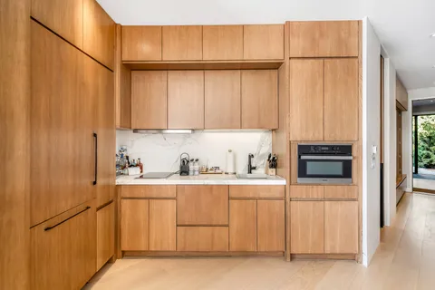 a kitchen with stainless steel appliances a refrigerator and a sink